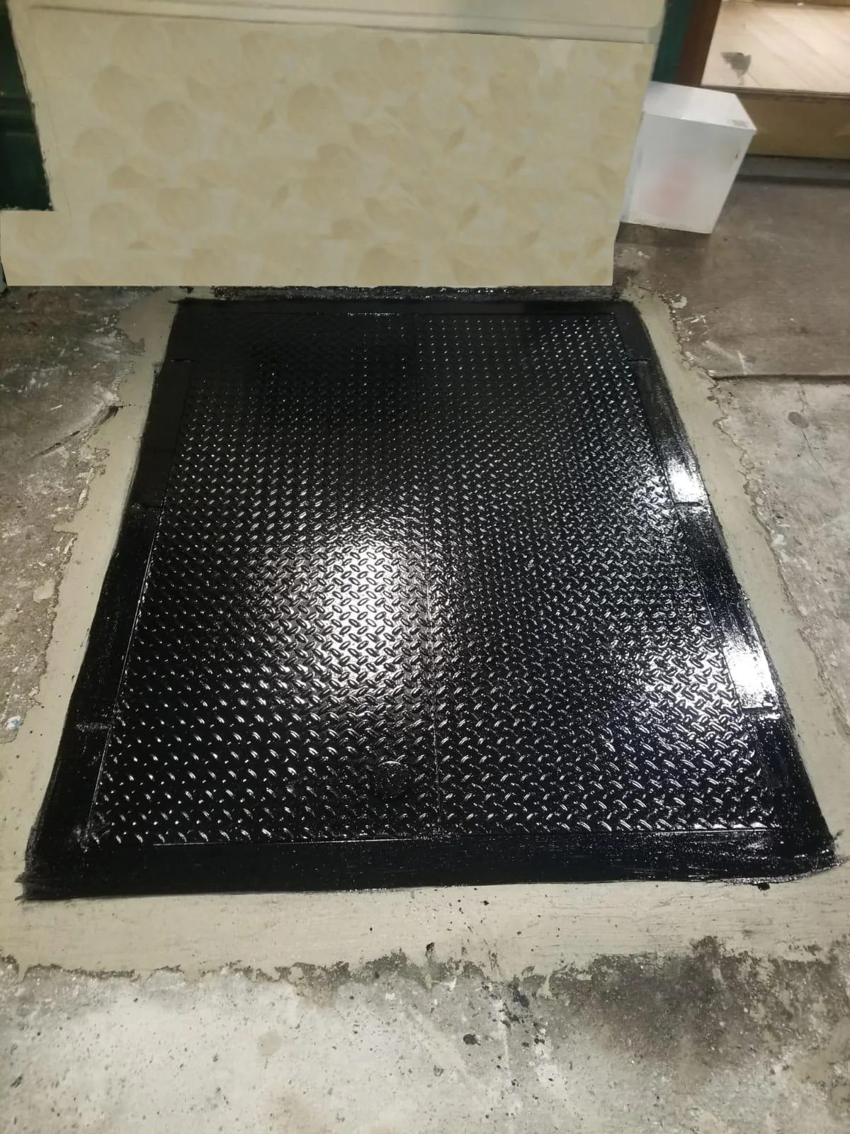 Black Dimond plate sidewalk cellar door in NYC